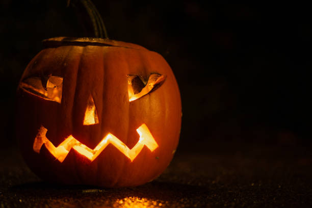 istock Halloween pumpkin on black background close up 1279037211