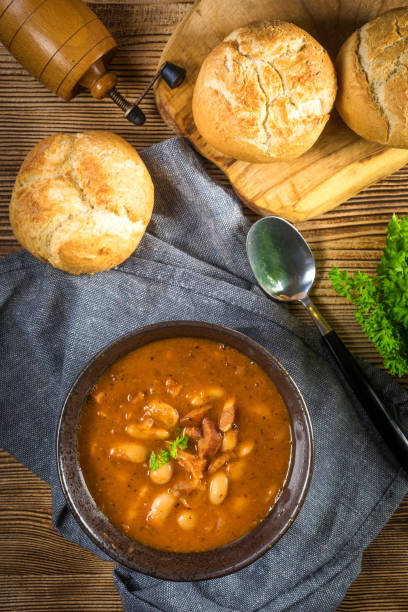istock Beans with tomato sauce, bacon and sausage. 1279037265