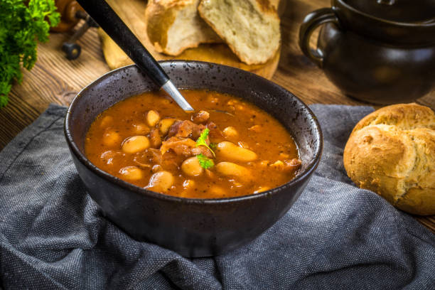 istock Beans with tomato sauce, bacon and sausage. 1279037281