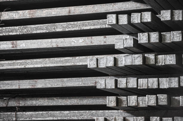 Steel billets in the warehouse of metallurgical factory. Hot ingot in a steel plant. Steel billets in the warehouse of metallurgical factory. Hot ingot in a steel plant. barracks stock pictures, royalty-free photos & images