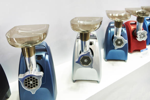 istock Colorful electric meat grinders on counter in store 1279040196