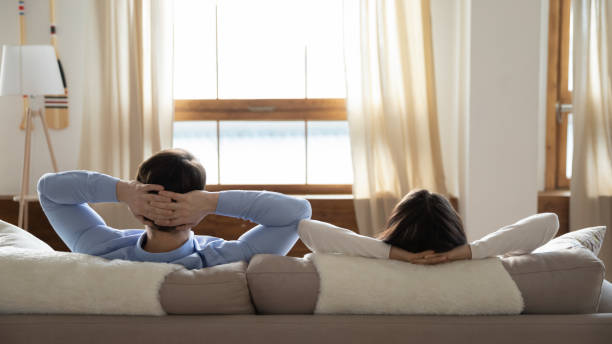 istock Millennial family resting on sofa in luxurious hotel 1279040664