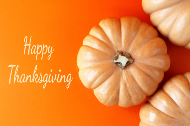 istock Round pumpkins bright orange background greeting card. 1279044683