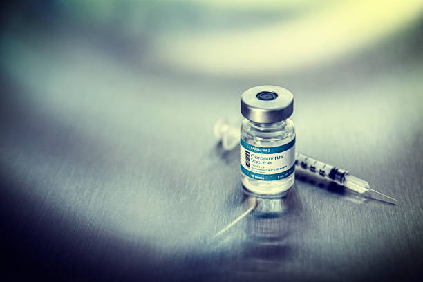 istock Coronavirus vaccine vials on a metal background 1279044691