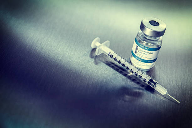 istock Coronavirus vaccine vials on a metal background 1279044699