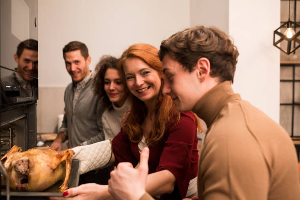 istock Family enjoying preparing Thanksgiving dinner together 1279045835