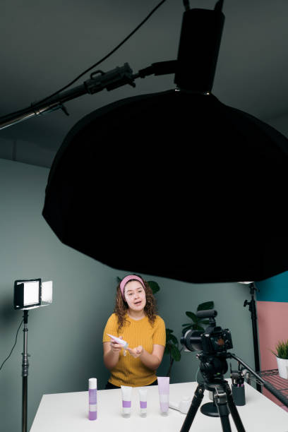istock Female vlogger using equipment to record herself 1279047831