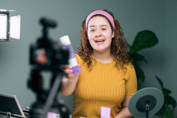 istock Female vlogger showing product to camera 1279047860