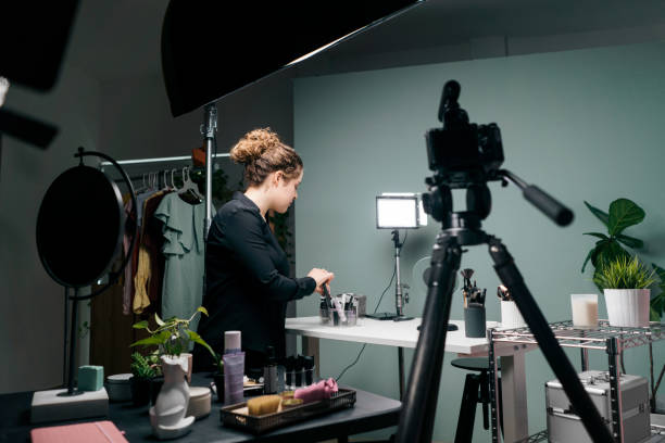 istock Female vlogger preparing set with products 1279047966