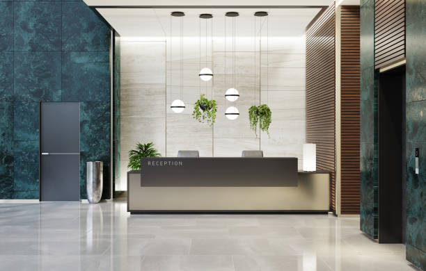 Modern Offices lobby interior area with elevators and stairs and with long reception desk Modern and luxurious Offices lobby interior area with elevators and stairs. Long reception desk.
green marble wall tiles decoration. 3d rendering gold desk lamp stock pictures, royalty-free photos & images