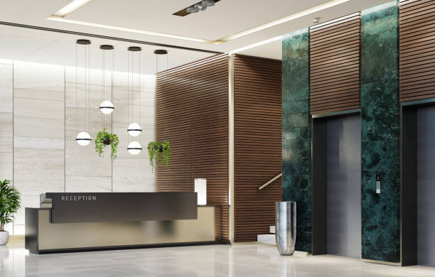 Modern Offices lobby interior area with elevators and stairs and with long reception desk Modern and luxurious Offices lobby interior area with elevators and stairs. Long reception desk.
green marble wall tiles decoration. 3d rendering gold desk lamp stock pictures, royalty-free photos & images