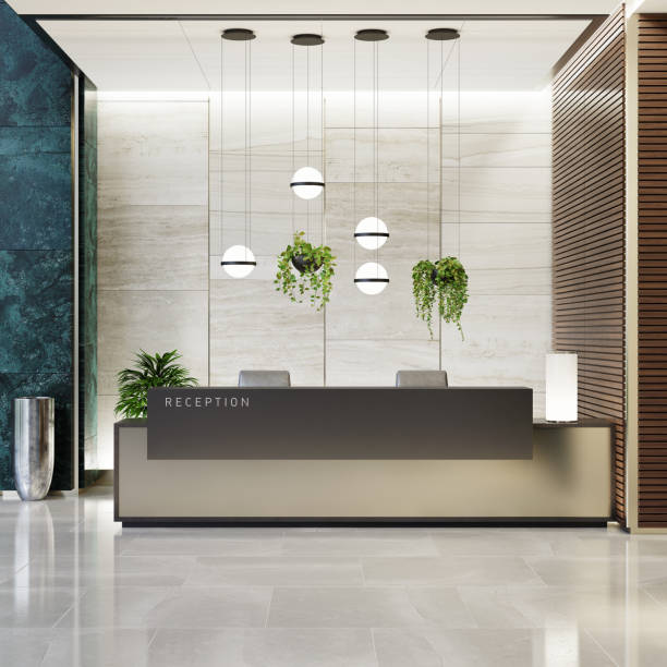 Modern Offices lobby interior area with elevators and stairs and with long reception desk Modern and luxurious Offices lobby interior area with elevators and stairs. Long reception desk.
green marble wall tiles decoration. 3d rendering gold desk lamp stock pictures, royalty-free photos & images
