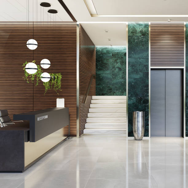Modern Offices lobby interior area with elevators and stairs and with long reception desk Modern and luxurious Offices lobby interior area with elevators and stairs. Long reception desk.
green marble wall tiles decoration. 3d rendering gold desk lamp stock pictures, royalty-free photos & images