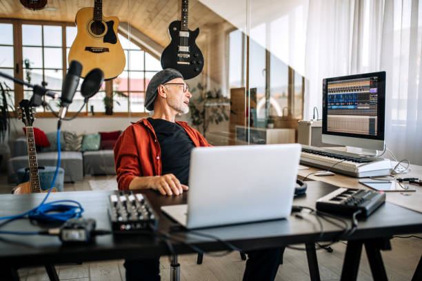 istock Senior musician playing digital piano at home 1279050441