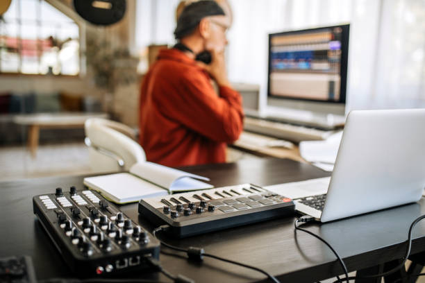 istock Senior musician working in his home music studio 1279050446