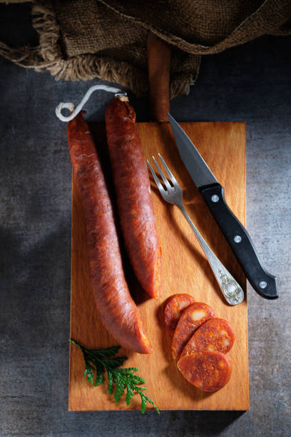 istock Spanish chorizo sausage on kitchen board 1279050565