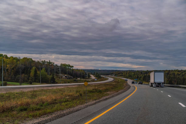 istock Divided Highway in Autumn Landscape 1279051495