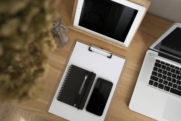istock Around the laptop and home workspace table 1279053751