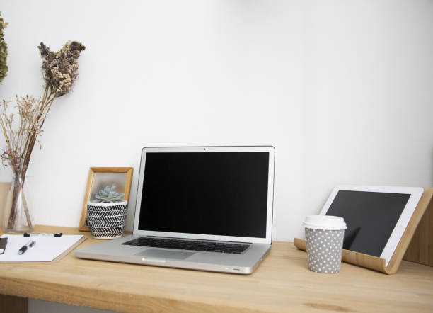 istock Around the laptop and home workspace table 1279053777