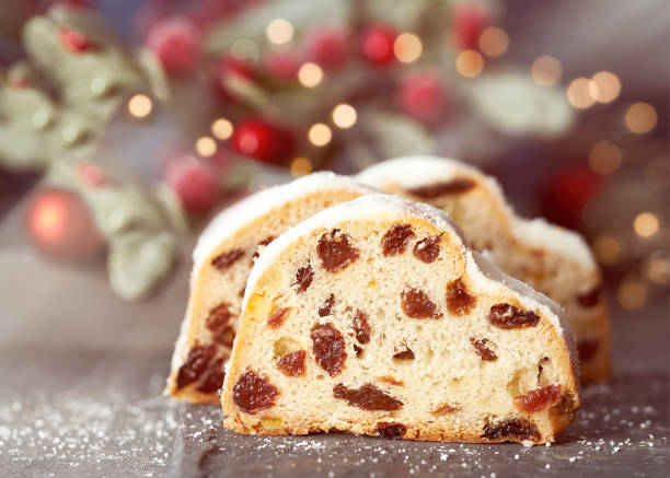 istock Christmas stollen on white-blue festive background with berries and Xmas lights 1279056208