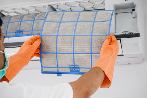istock Asian man cleaning air conditioner dirty filter 1279059068