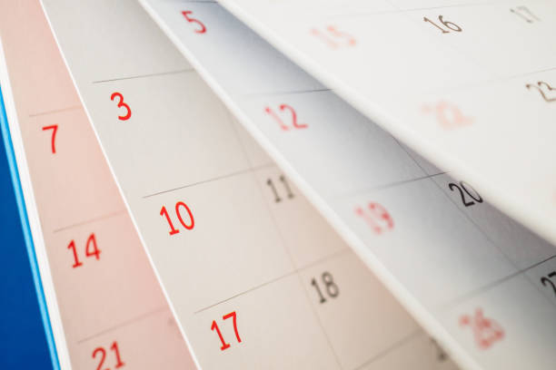 istock Calendar page flipping sheet close up on office table background business schedule planning appointment meeting concept 1279059159