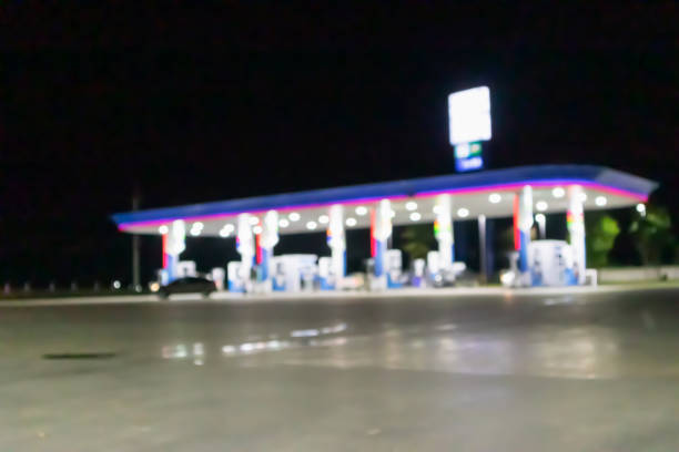 Petrol gas station at night time blurred background with bokeh light