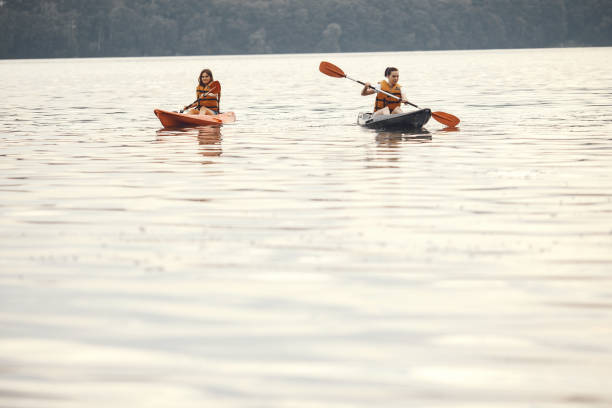 istock Women paddling on a lake in a kayak 1279061003