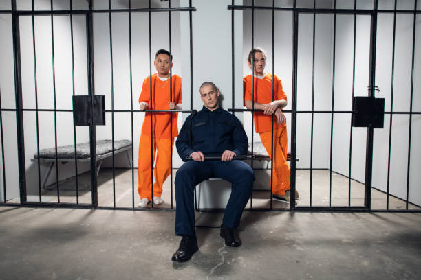 istock Two prisoners plan to attack a uniformed guard to escape from a maximum security prison. Wide shooting angle 1279065946
