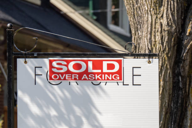 istock Sold over asking real estate sign 1279066124