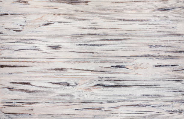 istock White wood planks and floor. Empty wooden table top with copy space 1279068444