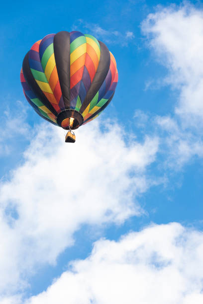 istock Hot Air Balloon Flying in Blue Sky with Clouds 1279075393