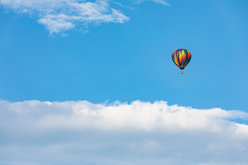 Colorful Hot Air Balloon Flying in a Blue Sky