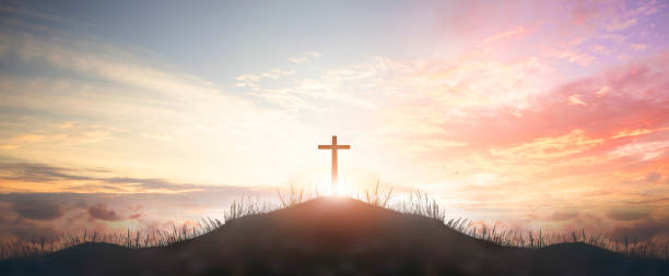 Holy concept: Silhouette cross on  mountain sunset background Holy concept: Silhouette cross on  mountain sunset background easter sunday photos stock pictures, royalty-free photos & images
