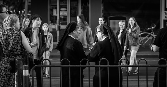 Melbourne, Victoria, Australia, November 10, 2018: A pair of nuns are talking to each other at a Melbourne tram stop in the city centre