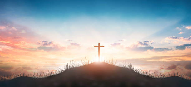 istock Christian concept: Silhouette cross on  mountain sunset background 1279078010