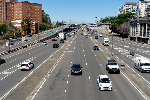 View of multi lane Warringah freeway going through North Sydney noon time.\n Australia, October 2020.
