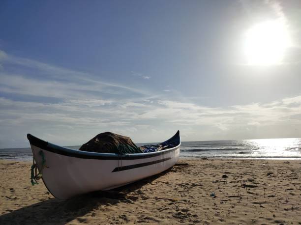 istock Boat in a Seashore at sunset. 1279080950