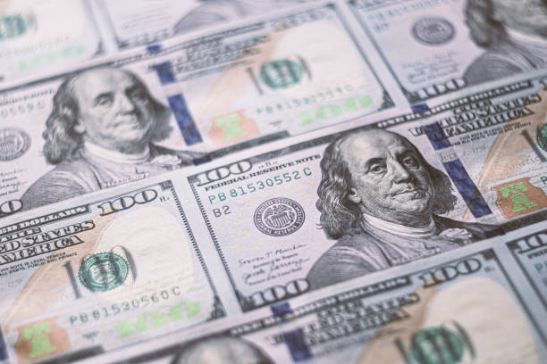 istock Closeup American dollars banknotes background. US dollars pattern. 100 dollars, Mr. Franklin 1279083604
