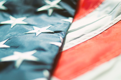 The flag of the United States of America. Old Glory. Closeup photo. Patriotic background