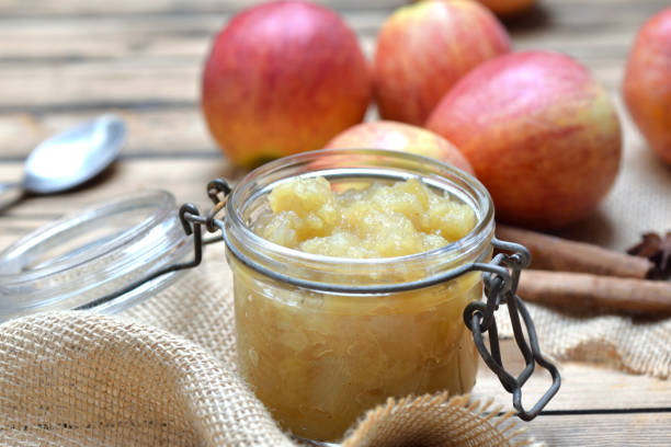 istock close on homemade compote  in a glass  jar with red apples  background 1279084697
