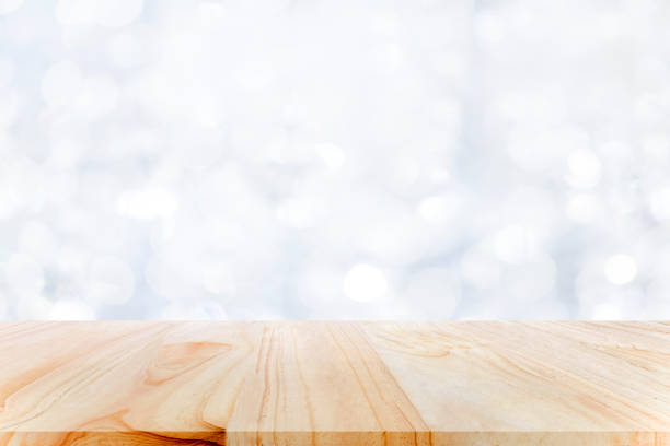 istock Wood table top on white bokeh abstract background. 1279087216
