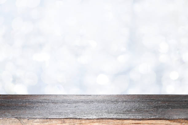istock Wood table top on white bokeh abstract background. 1279087223
