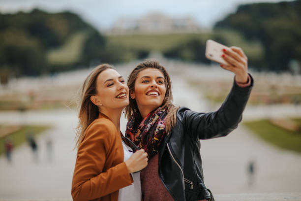 istock Happy female tourists taking selfie 1279088410