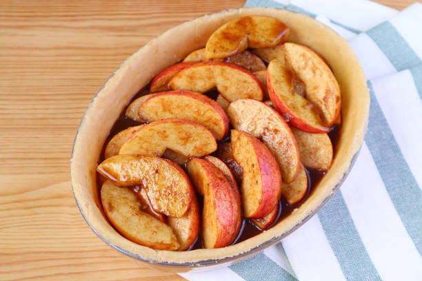 istock Pie plate with fresh mixed filling before baking a homemade apple pie 1279091500