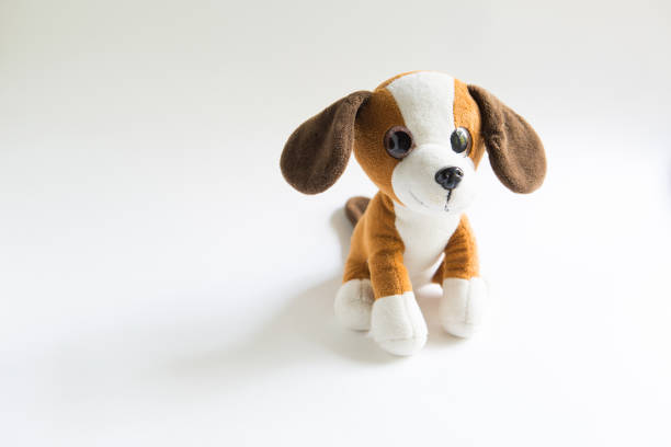 istock Plush soft toy dog brown with a white muzzle and paws, dark ears. 1279093684