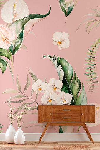 Empty tropical flowers and leaves wallpaper background with a console table on the right and decoration on hardwood floor with copy space. 3D rendered image.