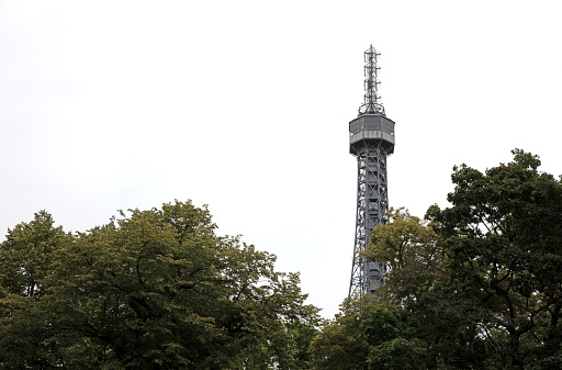 Petrin tower in Prague with view from the pedestal towards the sky, grey sky