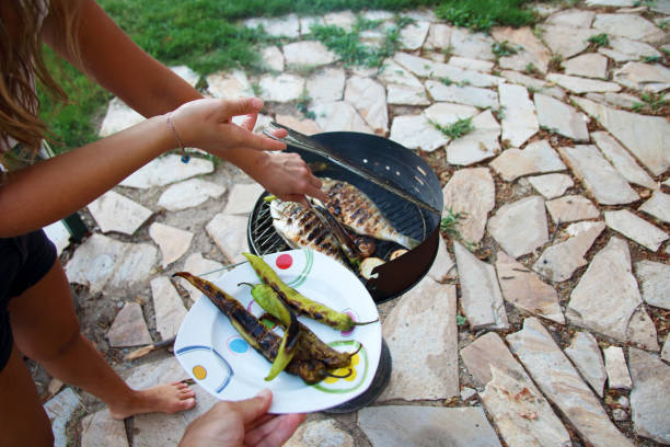 Grilled salmon steak with salad and mayonnaise