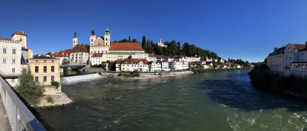 istock View to a small waterfall and church St. Michael in Steyr, Upper Austria 1279104628
